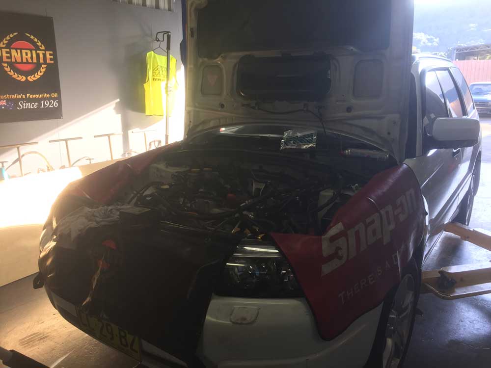 White Subaru open Hood — Mechanical Workshop in Bellambi, NSW