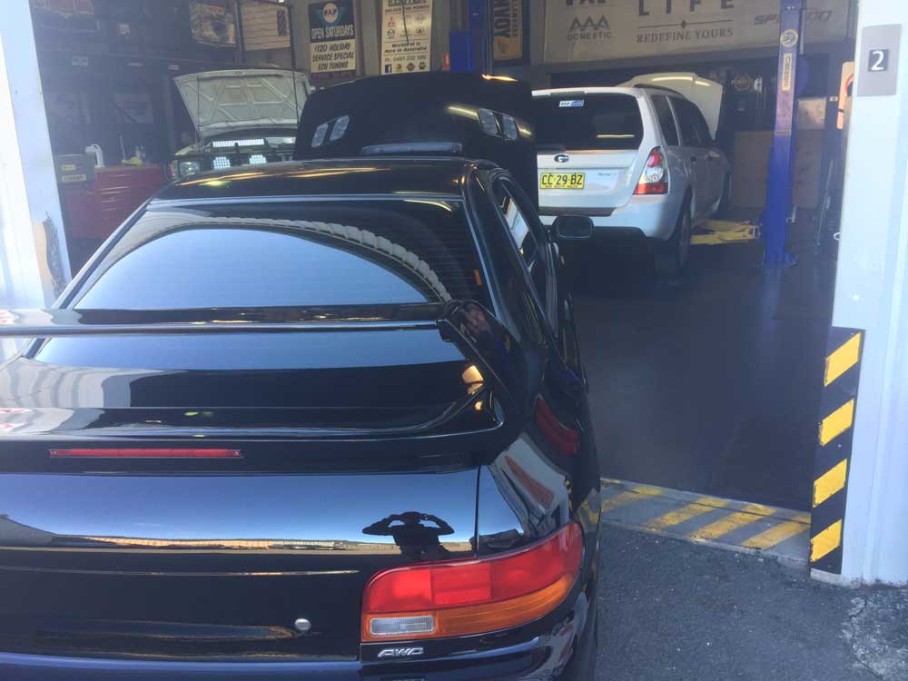 2 Cars on Garage — Mechanical Workshop in Bellambi, NSW