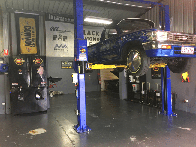 Car Suspended In The Air — Precision Automotive And Performance In Bellambi, NSW
